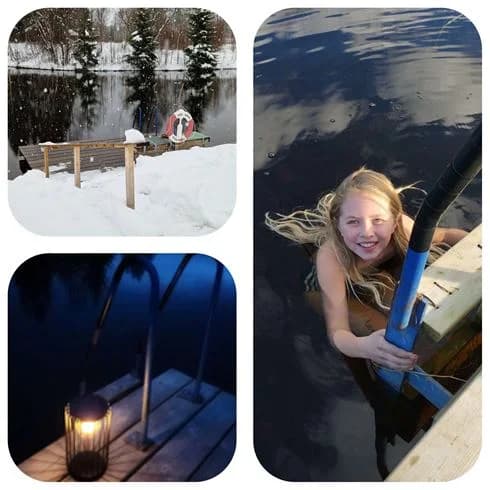 En vinterdag på Hede Camping, täckt av snö och omgiven av snöklädda träd, vilket skapar en inbjudande atmosfär för en avkopplande vintersemester.